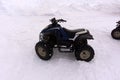 Quad bike in the snow ATV is a yellow color. ATV rentals Royalty Free Stock Photo