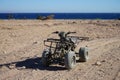 Quad bike stands on the shore of the Gulf of Aqaba. Dahab, South Sinai Governorate, Egypt Royalty Free Stock Photo