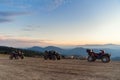 ATV Quad Bikes on the mountain top at sunset landscape background.