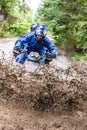 Quad biking down a countryside farm track.