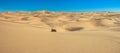 Quad driving in sand desert. ATV standing in middle of nowhere in sand dunes desert with skid marks. Africa, Namibia Royalty Free Stock Photo