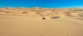 Quad driving in sand desert. ATV standing in middle of nowhere in sand dunes desert with skid marks. Africa, Namibia Royalty Free Stock Photo