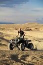 Quad in hills - teen on four wheeler Royalty Free Stock Photo