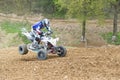 Quad rider is falling to the ground on the front wheels