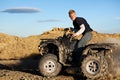 Quad - teen driving four wheeler Royalty Free Stock Photo