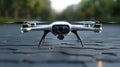 A quadcopter drone sitting on top of a brick road Royalty Free Stock Photo