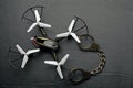 Quadcopter handcuffs dark leather background