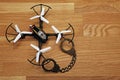 Quadcopter handcuffs wooden desk background