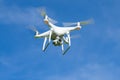 The quadcopter Phantom 4 Edvanced with the digital camera in flight in the sunny day Royalty Free Stock Photo