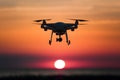 Quadcopters silhouette against sunset sky, capturing aerial photography