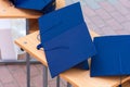 Quadrangular cap as a symbol of a graduate. Background with selective focus and copy space Royalty Free Stock Photo
