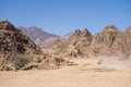 Quadricycle safari park in Egypt sand desert. Mountains landscape. Royalty Free Stock Photo