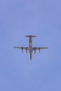 Quadro turboprop airplane flying in blue sky Royalty Free Stock Photo