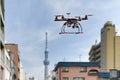 Quadrocopter drone in city.