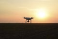 Quadrocopters silhouette against the background of the sunset