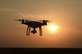 Quadrocopters silhouette against the background of the sunset