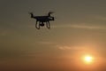 Quadrocopters silhouette against the background of the sunset