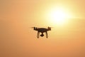 Quadrocopters silhouette against the background of the sunset