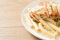 Quadrotto penne pasta white creamy sauce with grilled chicken Royalty Free Stock Photo