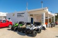 Quads and cars parked in row on outdoor parking, Folegandros Island, Greece