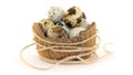 Quail eggs in a basket of coconut shell isolated on a white background Royalty Free Stock Photo