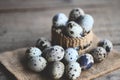 quail eggs on basket, fresh quail eggs on wooden table background, raw eggs with peel egg shell Royalty Free Stock Photo