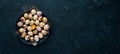 Quail eggs in a black plate. On the old background. Royalty Free Stock Photo