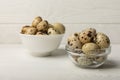 Quail eggs in a bowl on a white texture background. Royalty Free Stock Photo