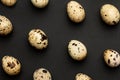 Quail eggs close-up on a black backgroundHoliday easter, minimalistic black composition