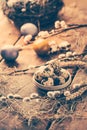 Quail eggs for Easter and blooming pussy willow branches on wooden background