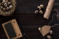 Quail eggs in nest, notebook and thread on a black background Royalty Free Stock Photo
