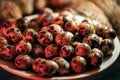 Quail eggs in a plate on the background of quails. Royalty Free Stock Photo