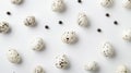 Quail Eggs Scattered on a White Background