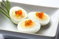 Quail eggs with trout eggs and chive Royalty Free Stock Photo