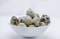 Quail eggs in a white plate. Food eggs on a white background Royalty Free Stock Photo