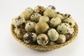 Quail eggs in a wicker oval shape