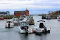 Adorable historic seaside town with quaint facade of shops and all types of boats, Rockport Mass, 2018