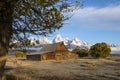 quaint Moulton barn wintry autumn weather on snow capped Grand Teton national Park in Wyoming Royalty Free Stock Photo