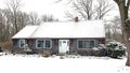 Quaint New England saltbox house in winter Royalty Free Stock Photo