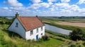 Quaint White Cottage Beside River in English Countryside Royalty Free Stock Photo