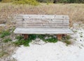 Quaint wooden bench along a sidewalk Royalty Free Stock Photo