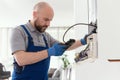 Qualified engineer servicing a boiler Royalty Free Stock Photo