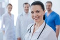 Qualified medic expressing confidence with colleagues at work Royalty Free Stock Photo