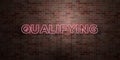 QUALIFYING - fluorescent Neon tube Sign on brickwork - Front view - 3D rendered royalty free stock picture