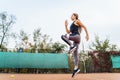 Qualitative warm-up. Warming up your muscles before an intense tennis workout on the court. Preparatory steps for an important Royalty Free Stock Photo