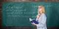 Qualities that make good teacher. Principles can make teaching effective. Woman teaching near chalkboard in classroom
