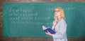 Qualities that make good teacher. Principles can make teaching effective. Woman teaching near chalkboard in classroom Royalty Free Stock Photo