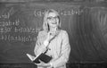 Qualities that make good teacher. Woman teaching near chalkboard. Principles can make teaching effective and efficient Royalty Free Stock Photo
