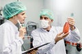 Quality control and food safety team inspection the product standard in the food and drink factory production line Royalty Free Stock Photo