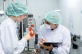 Quality control and food safety team inspection the product standard in the food and drink factory production line Royalty Free Stock Photo